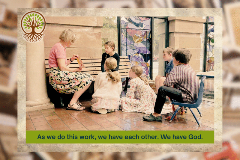 A Broad Street Presbyterian Church member teaching children near the stained glass windows—a moment of faith shared across generations.