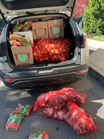 Volunteer loading fresh food for Broad Street Presbyterian Church Food Pantry in Columbus